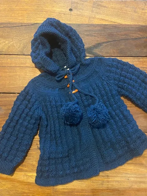 Hand Knitted Hooded Jacket with Pom Poms