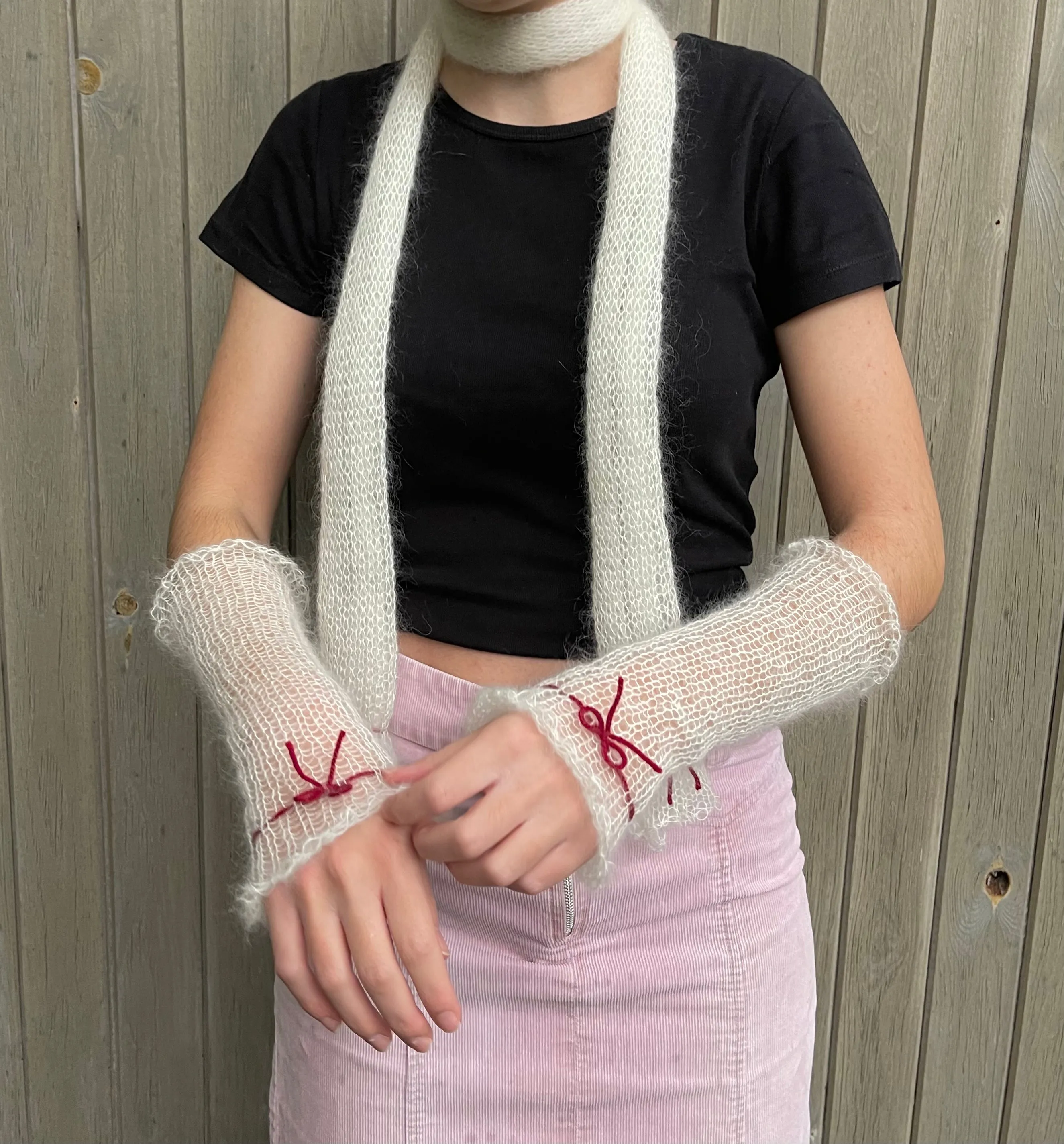 Handmade knitted mohair hand warmers in cream with dark red bow